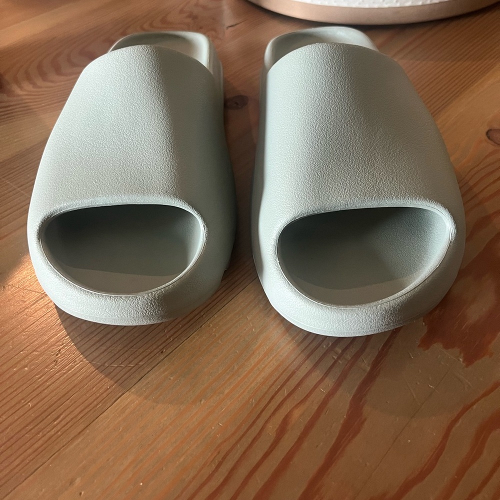 Size 11 yeezy slides in salt color.